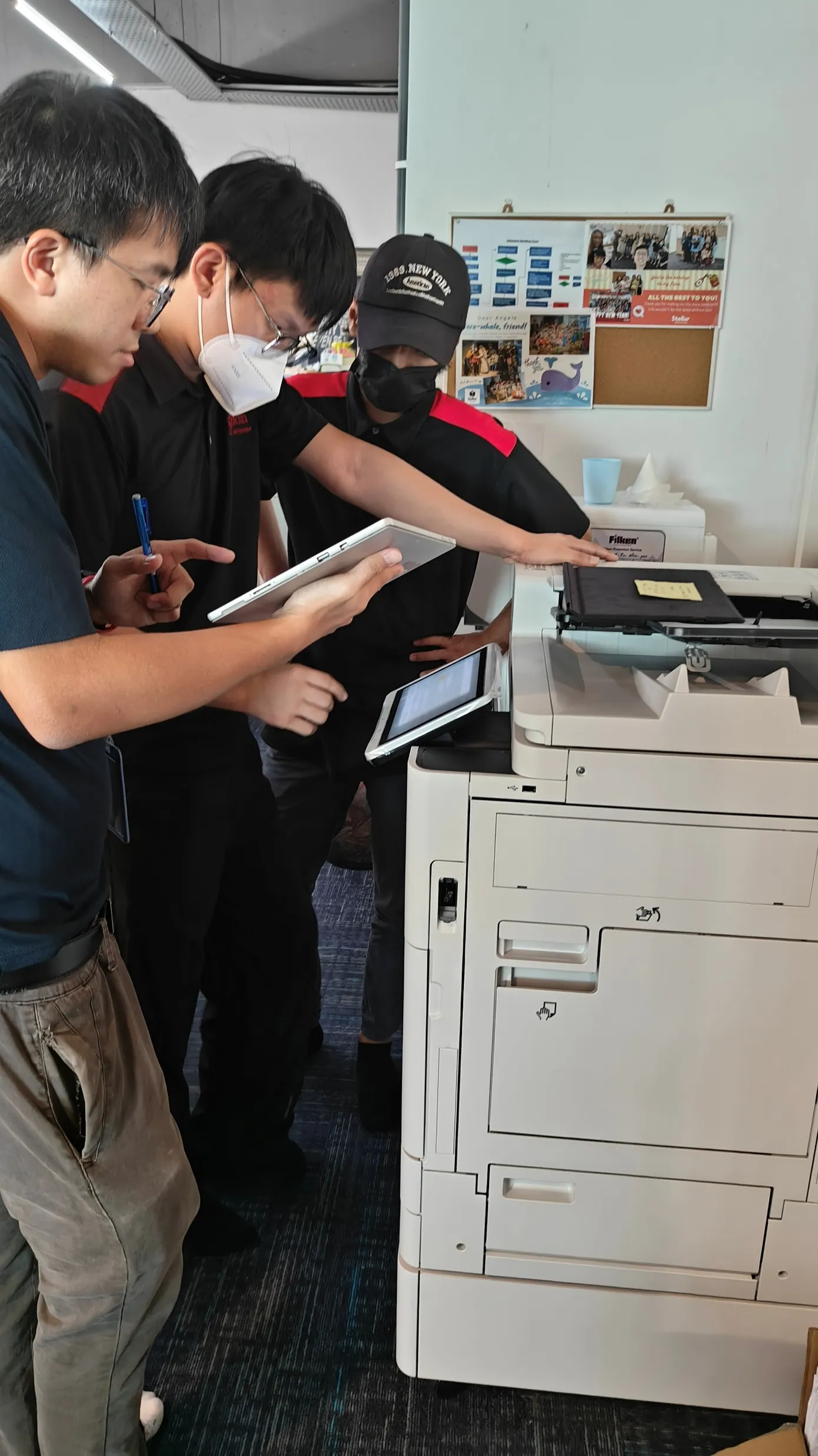 Region technicians setting up a copier at an international school